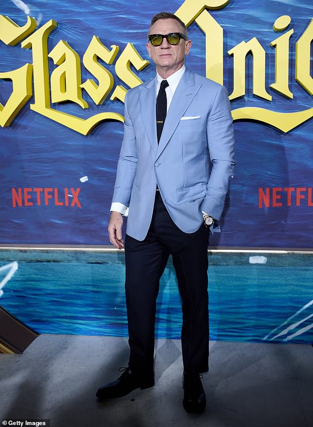 Posing up a storm: Daniel Craig cut a dapper figure as he attended his new film Glass Onion: A Knives Out Mystery premiere at the Callao cinema, in Madrid Spain on Wednesday