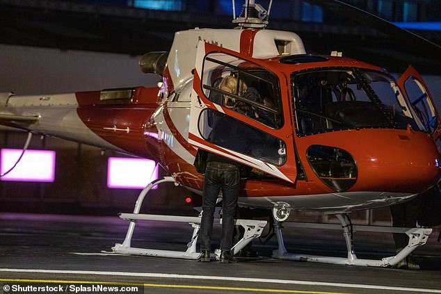 Gentleman: Tom reached out an arm to assist the 36-year-old actress out of the passenger seat and onto the tarmac