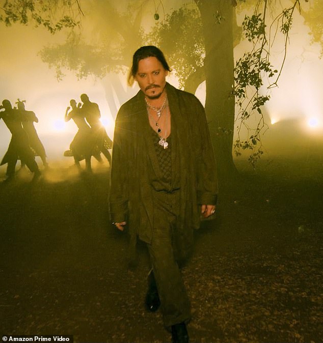 New men's fashion: He appeared to be wearing the deep forest green 'Sheer X Smoking Jacket' and 'Sheer X Sleep Pant' along with a low neck tank top from the Savage brand